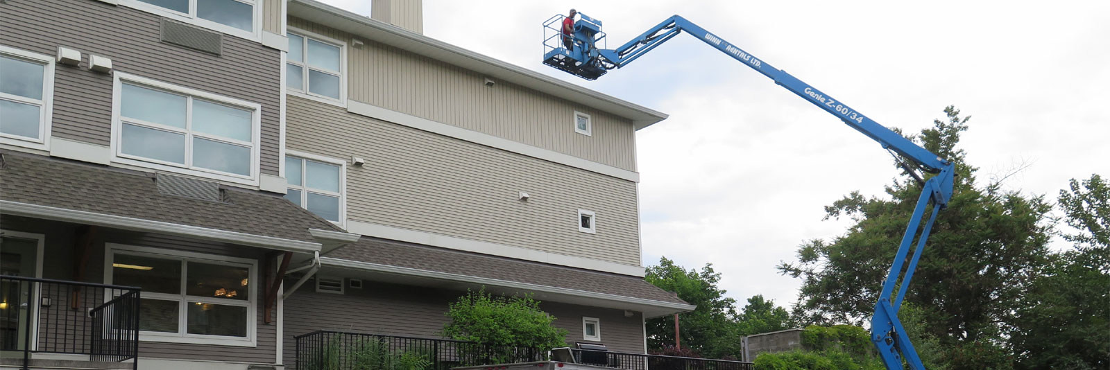 high pressure power wash wand working in gutter