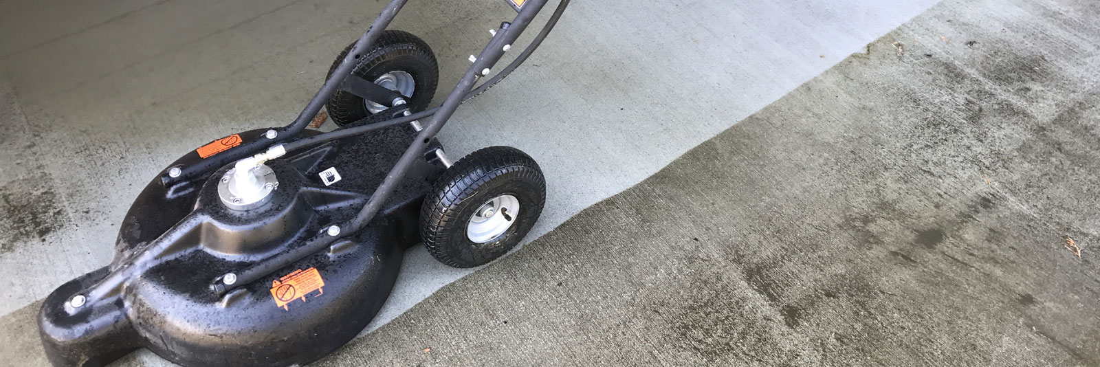 special power washer equipment cleaning driveway